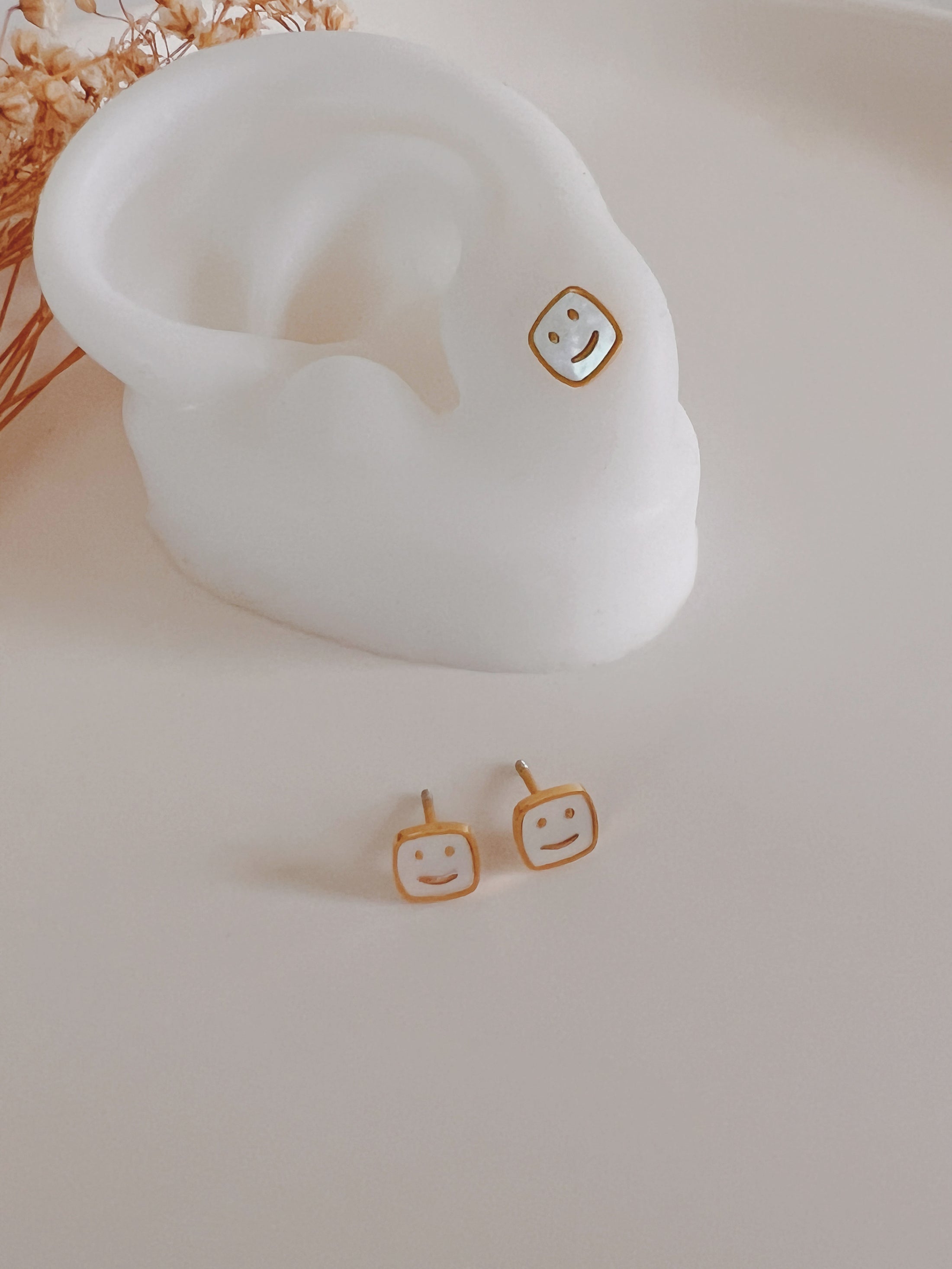 Happy  face  studs 2