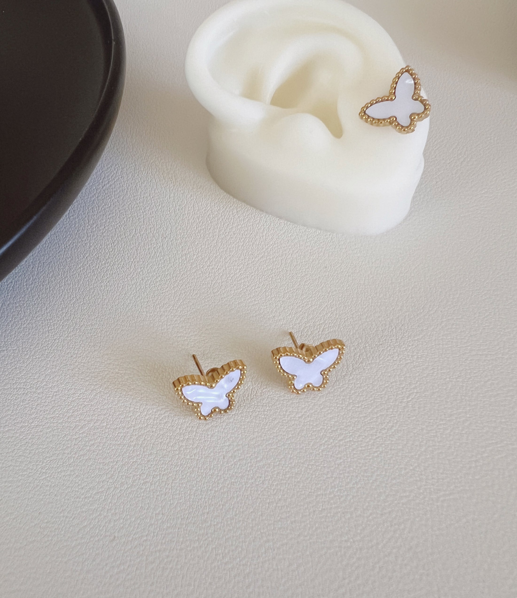 White butterfly studs