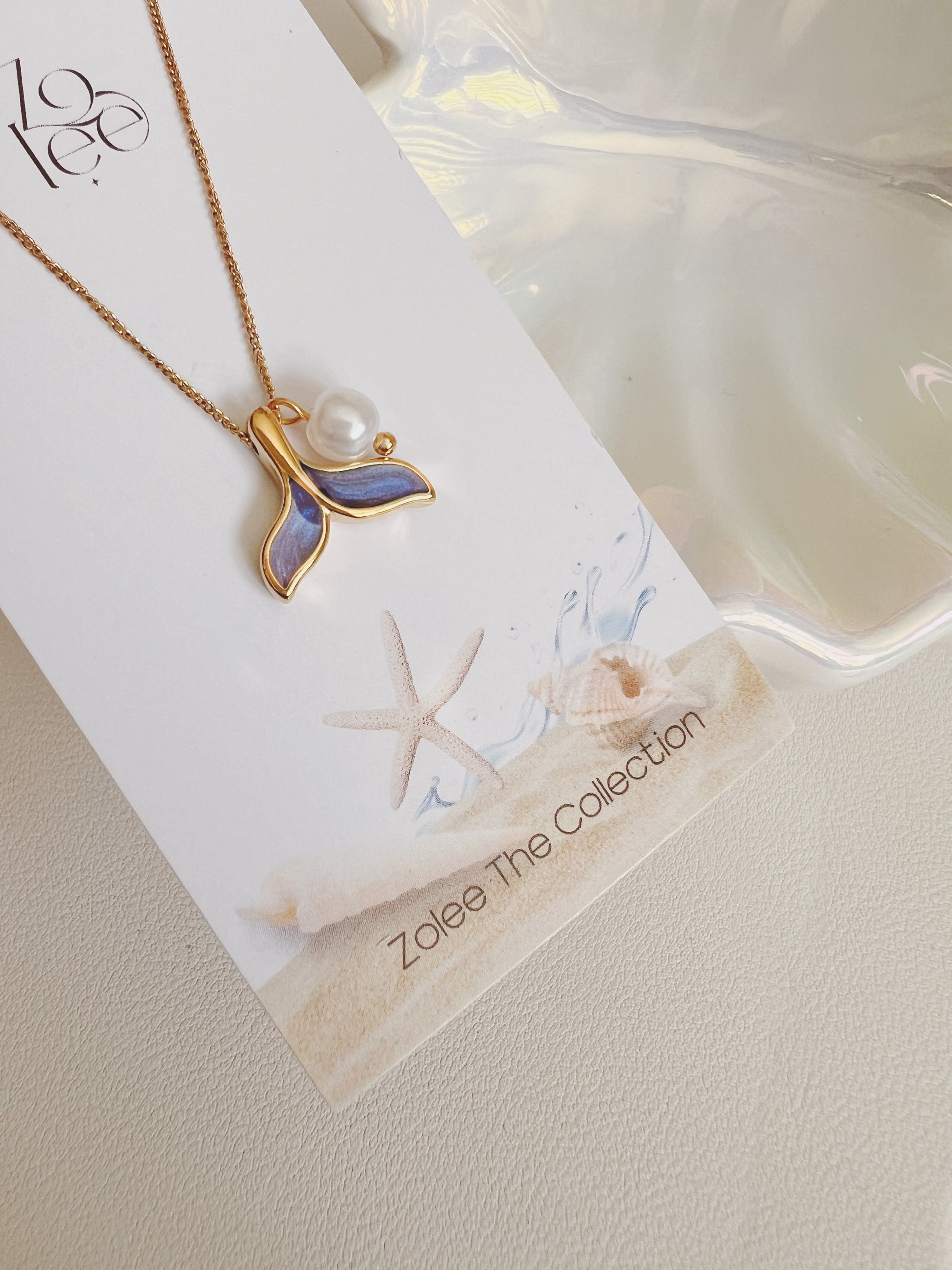 Blue tail necklace