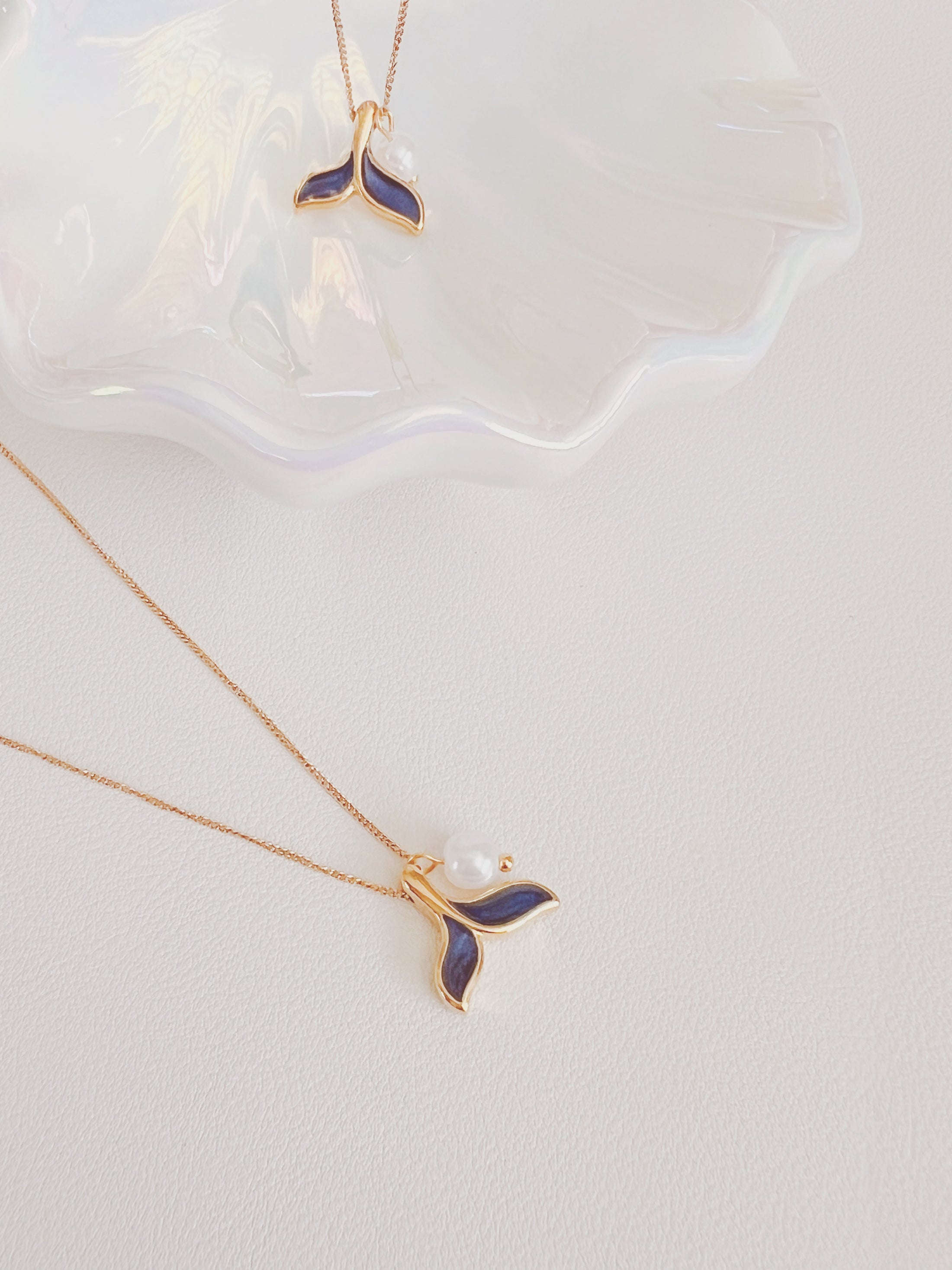 Blue tail necklace